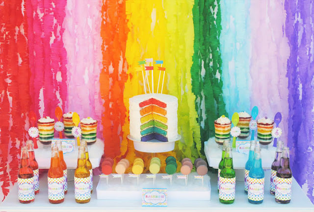 Rainbow backdrop created from crepe paper streamers.