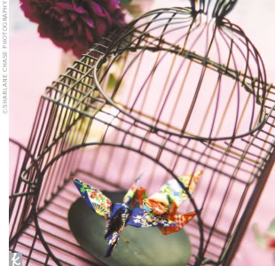 birdcage centerpiece featuring origami birds