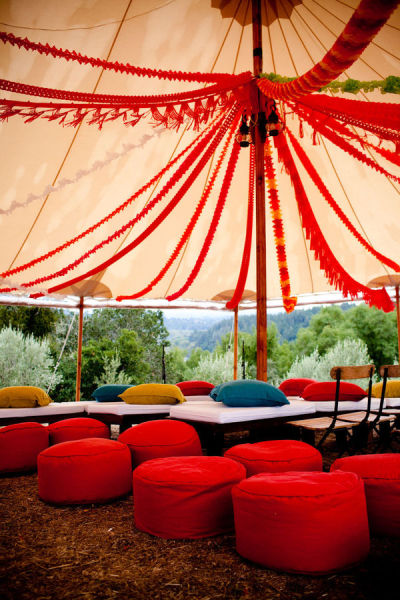 Wedding in a tent, wedding lounge in a tent, red and yellow and orange tent decor