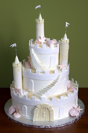 Beach themed castle cake with fondant seashells for wedding cake