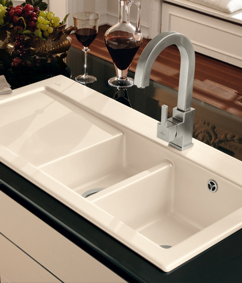 Modern kitchen sink with two bowls and a draining tray