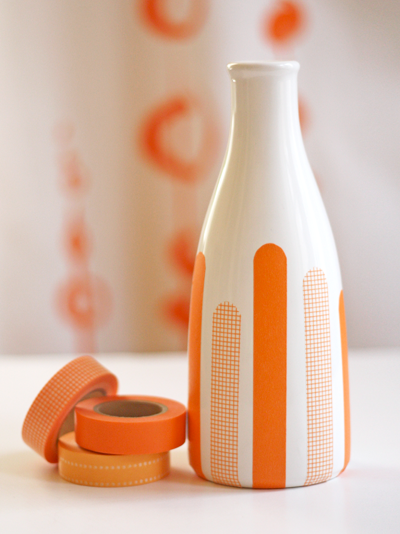 Beautiful washi tape decorated vase or bottle with shades of orane and white