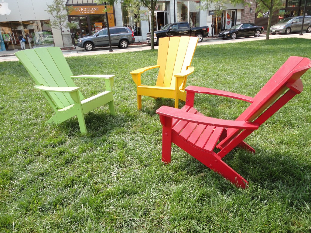 Painted Adirondack chairs in the park