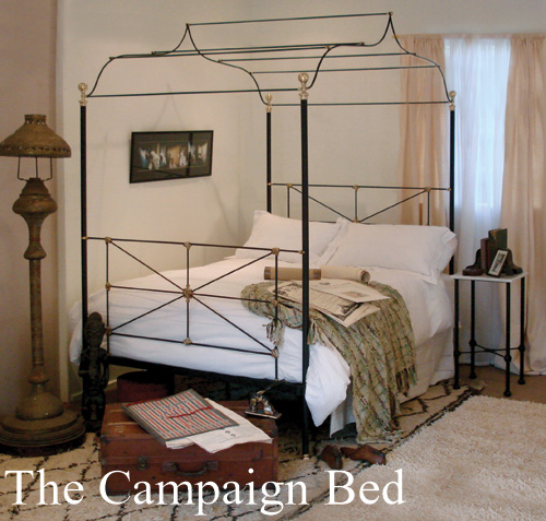 Metal canopy bed which is also a campaign bed, true to the design of the original