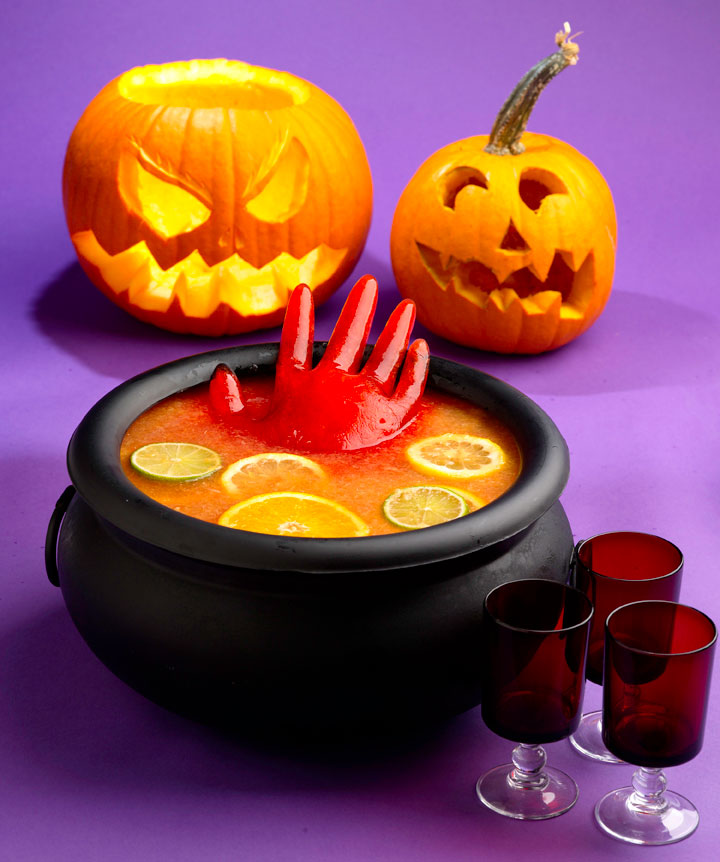 Spooky Halloween punch with floating hand made of ice