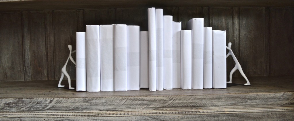 Books covered in white paper.