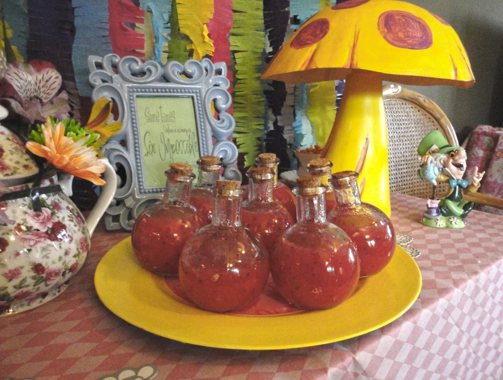 Fun tiny bottles of watermelon soup for an Alice in Wonderland tea party