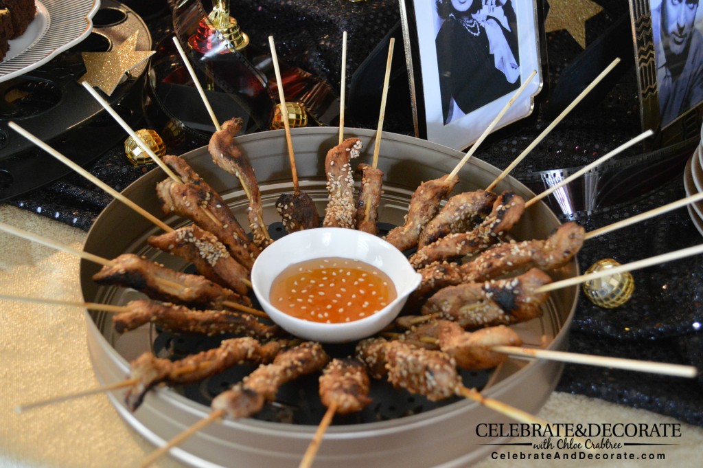 Honey-Ginger-Chicken-skewers served in a film can for an Academy Awards Party