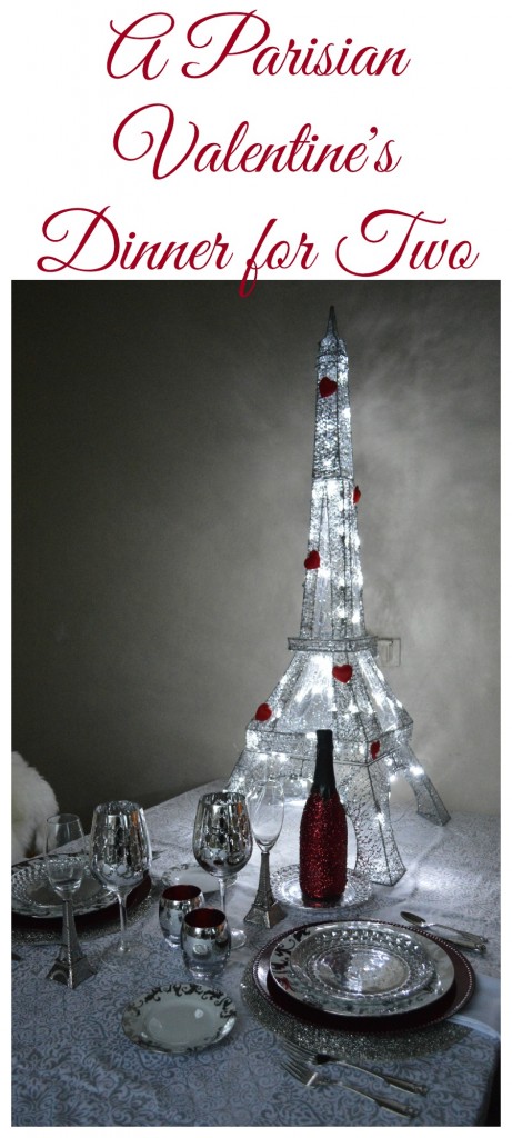 A Parisian themed Valentine's Dinner with light up eiffel tower with red hearts on it and silver place settings 