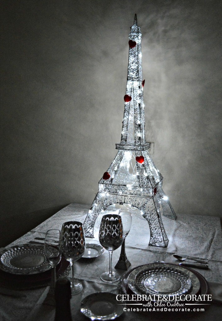 A Paris themed Valentine's Dinner for Two.  A Parisian themed Valentine's Dinner with light up eiffel tower with red hearts on it and silver place settings 