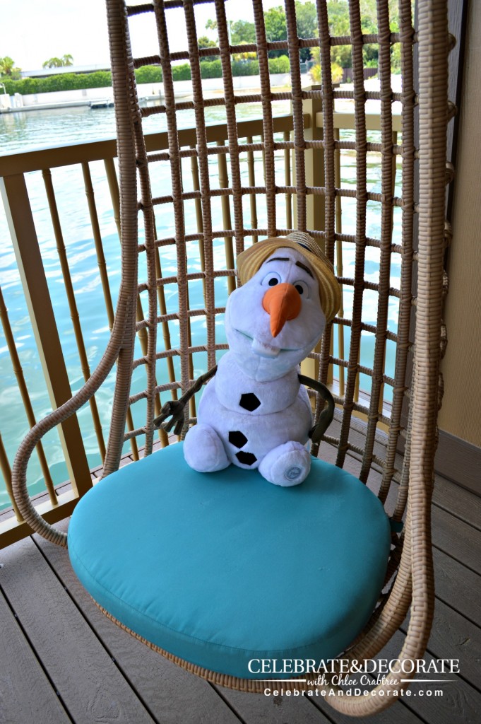 Olaf-enjoys-a-swinging-chair-at-Disney's-Polynesian-Resort