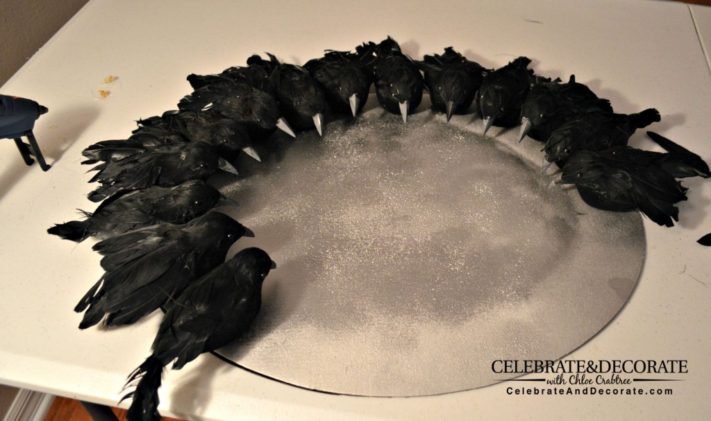 Crows being glued onto wreath form