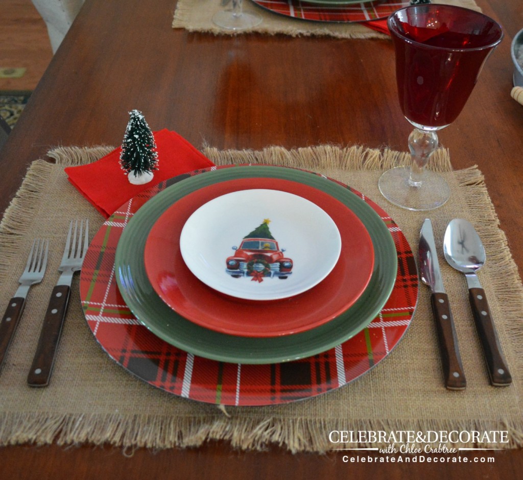 A Rustic Christmas Tablescape with red trucks with trees.
