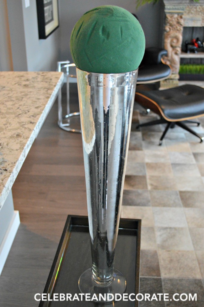 Tall Silver vase for arranging flowers.