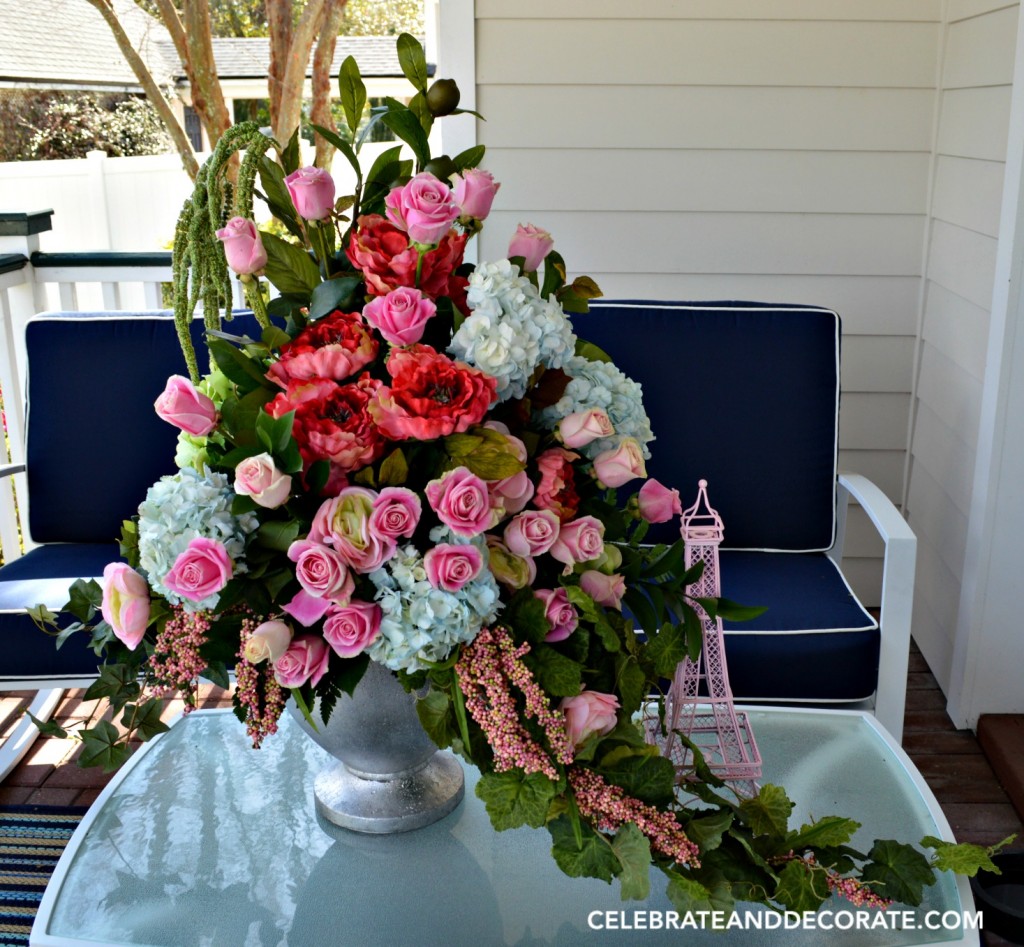 Abundant floral arrangement using a mix of fresh and faux flowers