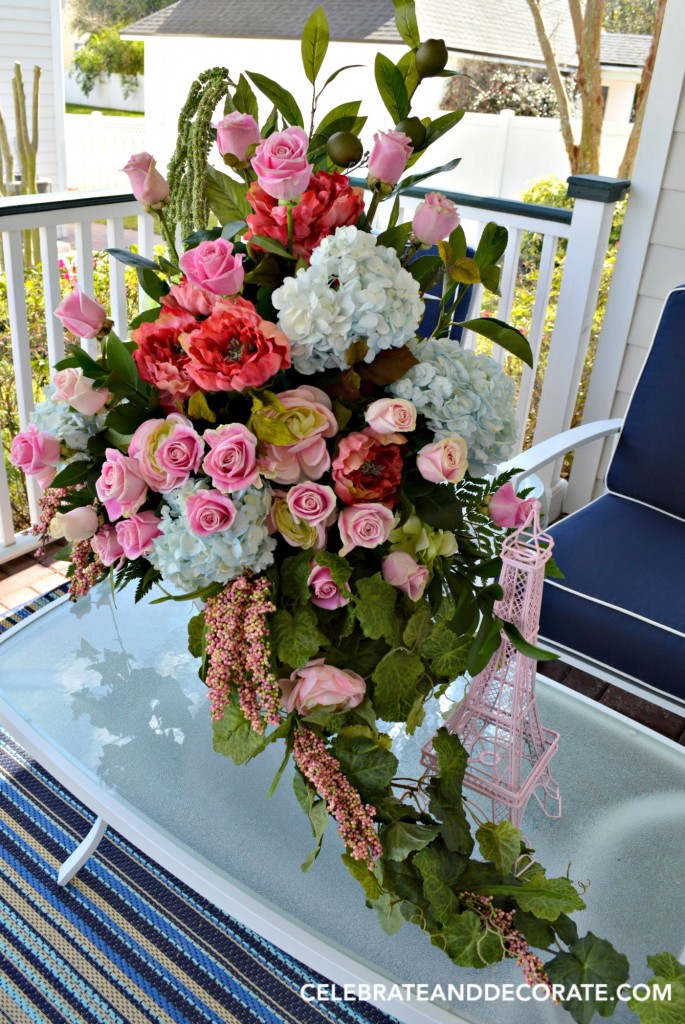 Artificial flowers mixed with fresh to create an abundant arranement