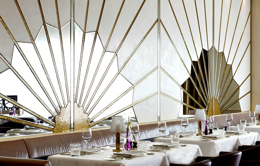 Sunburst Art Deco Mirrors behind a banquette