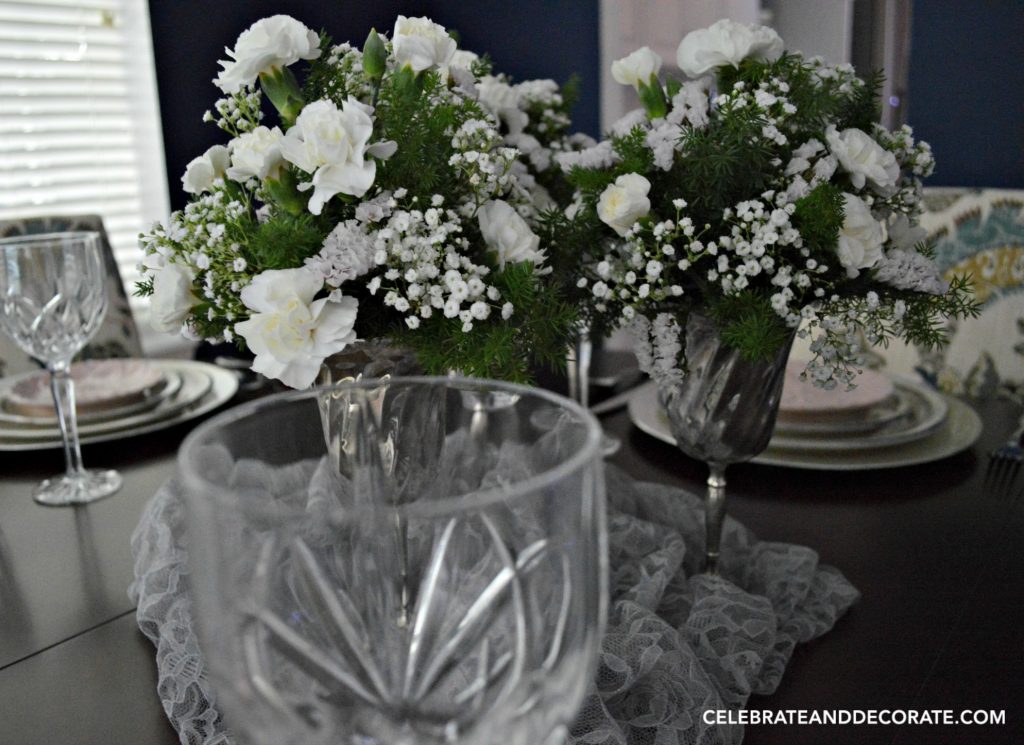 Simple and elegant tablescape with white floral centerpiece