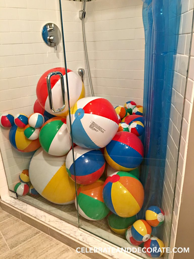 Fill the shower with beach balls for a summer party.