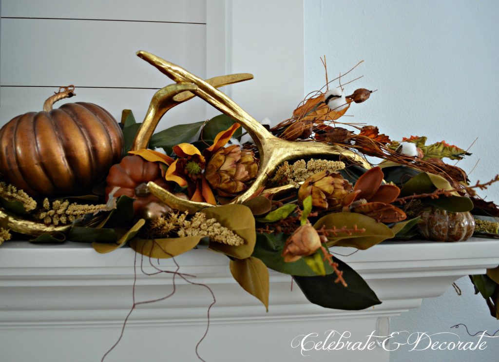 Gold antlers are a striking addition to this mantel display for Fall or Thanksgiving. 