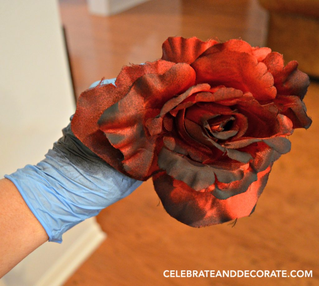 add-black-spray-paint-to-red-roses-for-a-spooky-look
