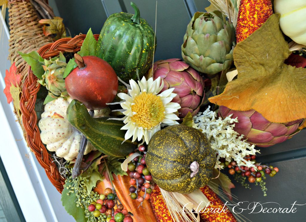 A Cornucopia wreath pours forth with the bounty of the harvest greeting guests for Thanksgiving