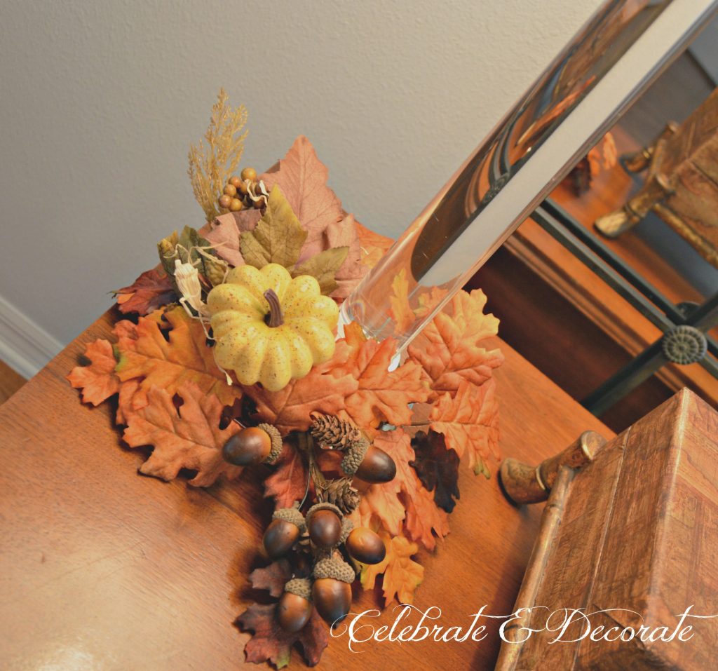 Fall floral picks and Fall leaf candle rings add a touch of Autumn to a pair of candlestick lamps