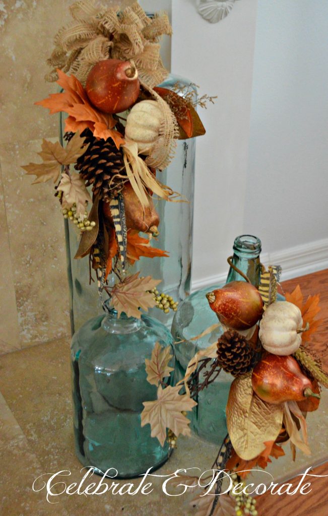 Coastal oversized jars were included in this Thanksgiving display by adding a couple of large Fall floral picks.