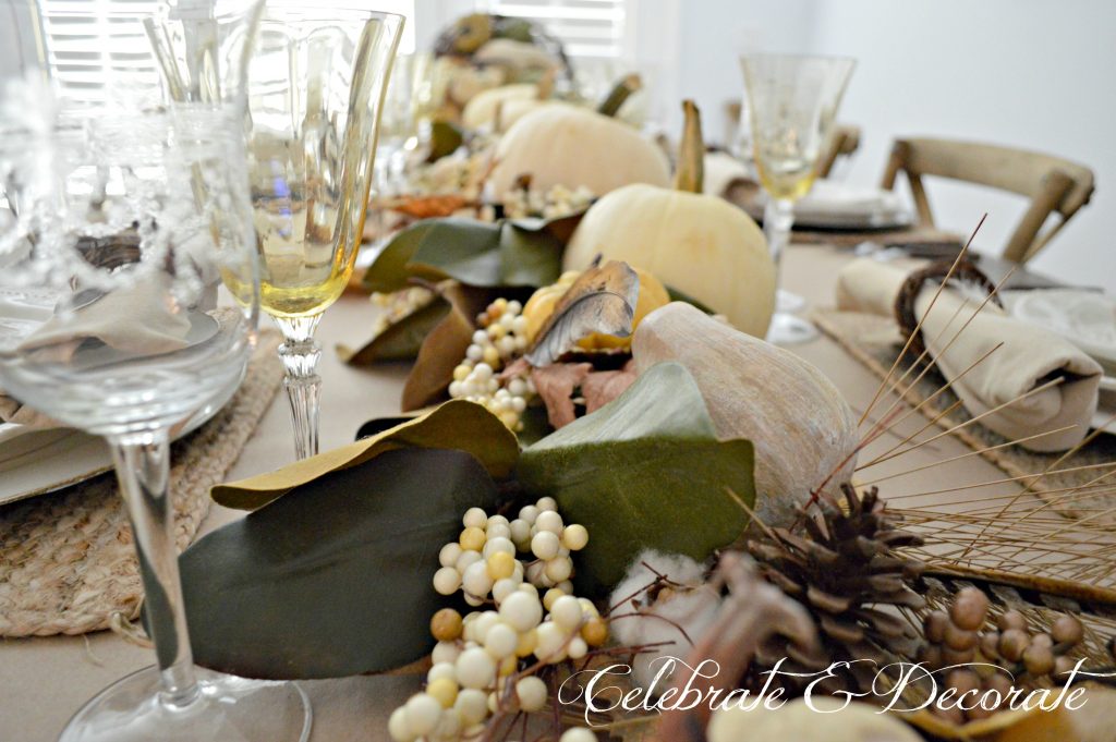 The bounty of the harvest flows down this Thanksgiving table from this grapevine cornucopia