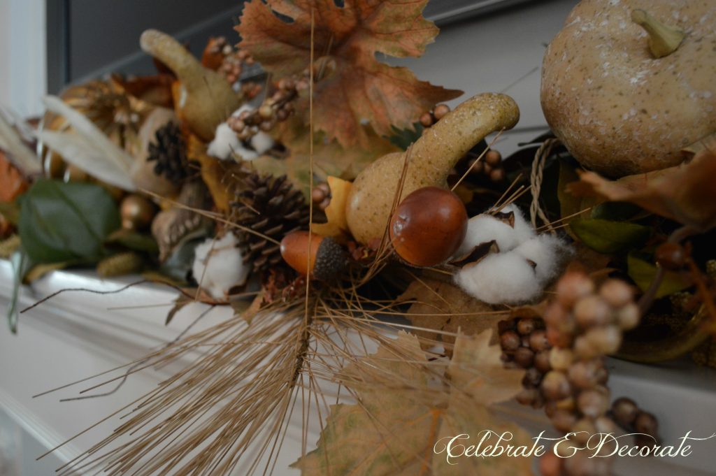 Adding Fall picks to a garland gives this mantel a lovely fullness 