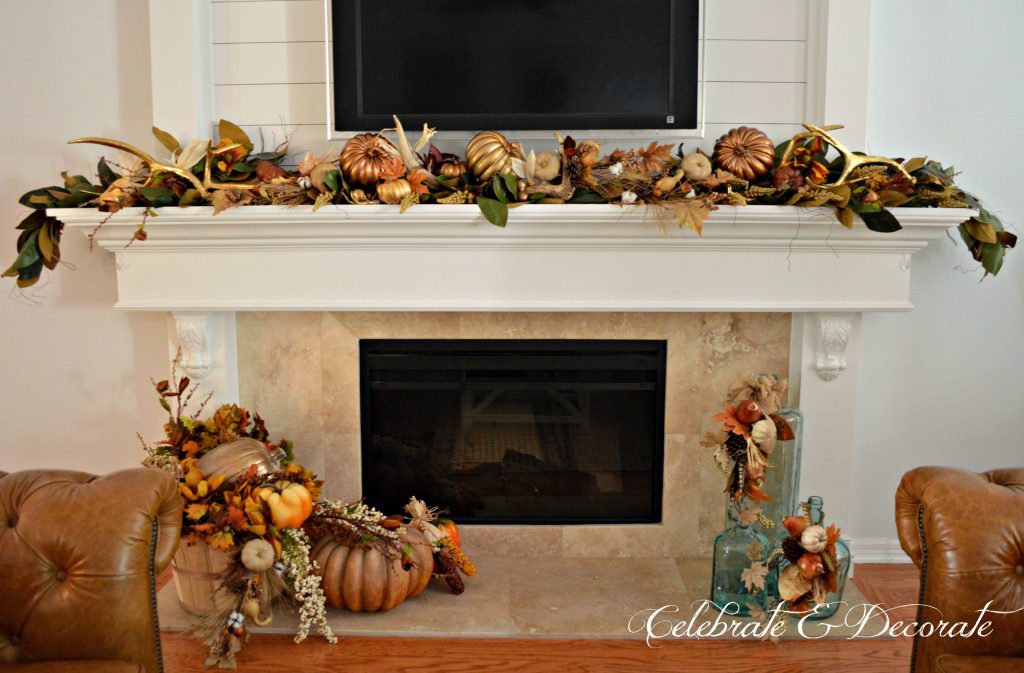 A mantel is decorated with the bounty of the harvest and pretty golden antlers 