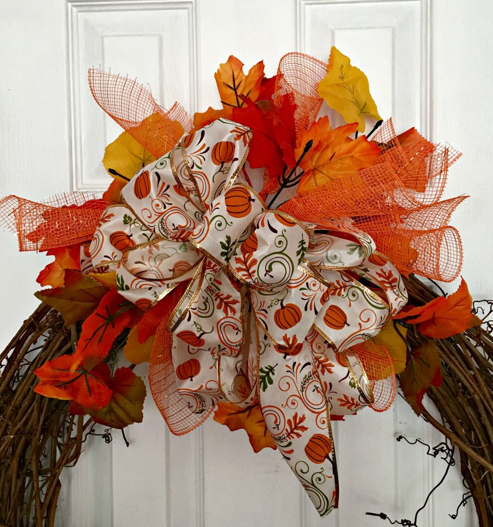 Make a fall wreath with a cute little scarecrow