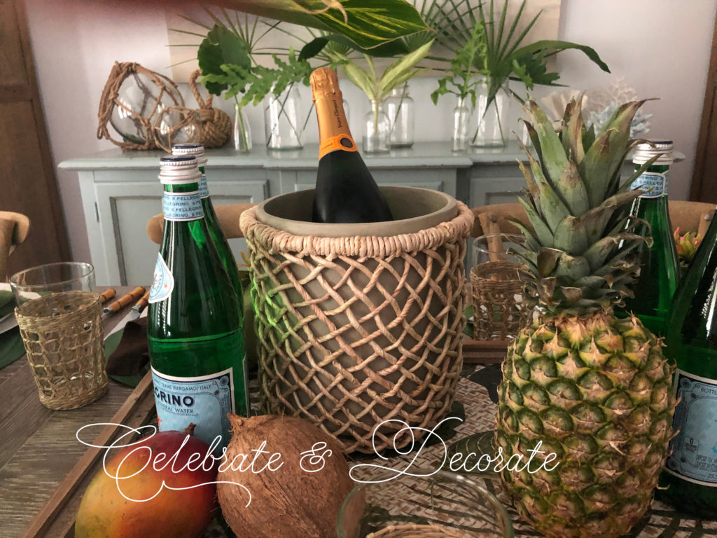 Tropical champagne bucket and tropical fruit centerpiece