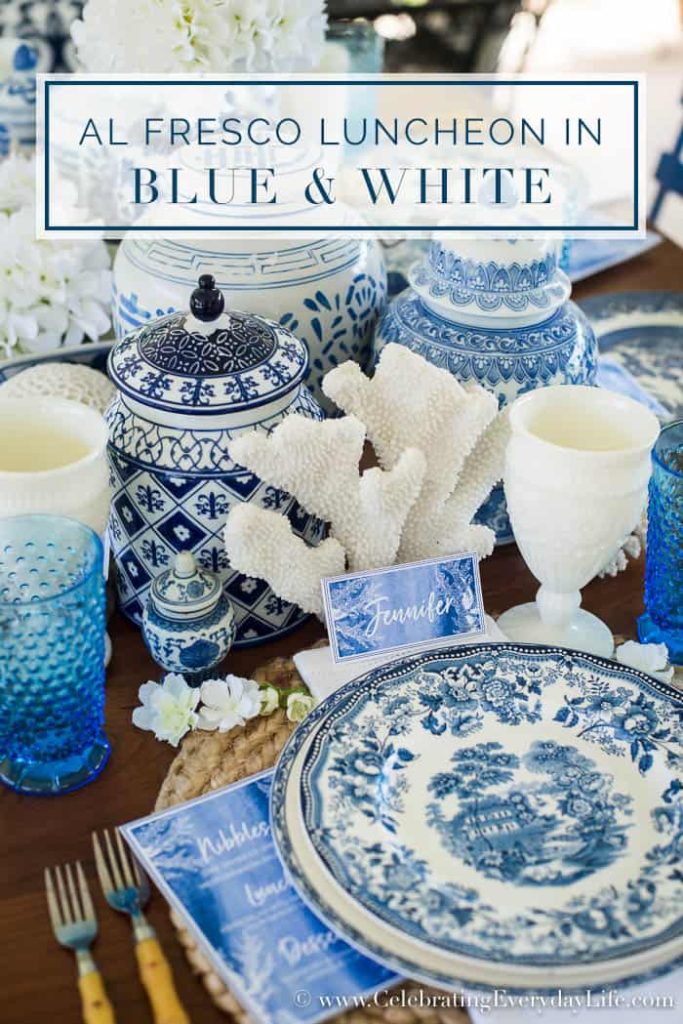 An alfresco luncheon with blue and white dishes and chinosiere