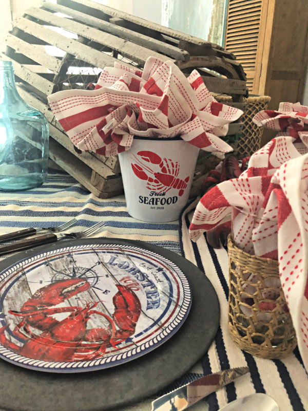 Vintage lobster trap and melamine lobster dinner plates
