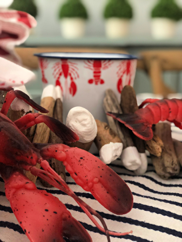 Plastic lobsters and a driftwood art piece
