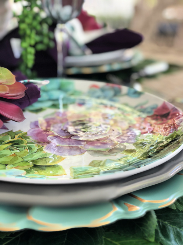Beautiful succulent dinner plates set the scene for a succulent themed tablescape