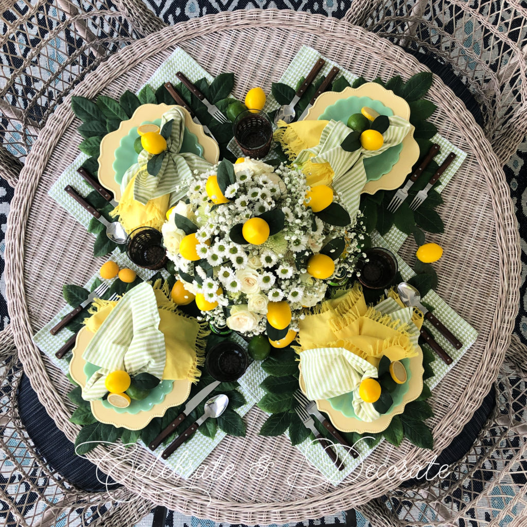overhead shot of a yellow and green table with lemons and limes
