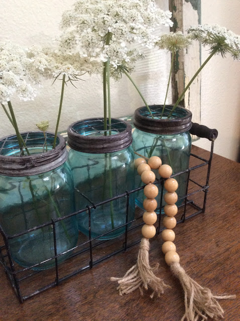 vintage mason jars with a wooden bead garland