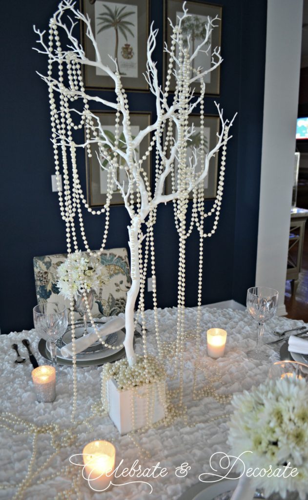 White branches with white pearls dripping from them as a winter centerpiece