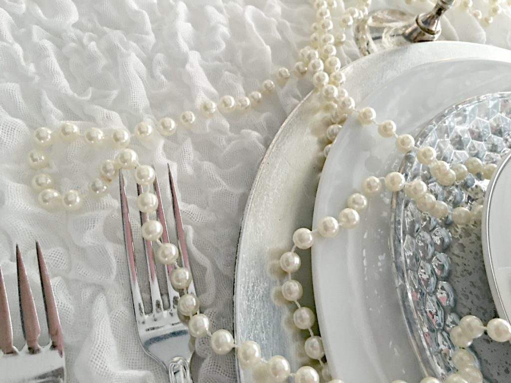 Silver flatware on a white tablecloth 