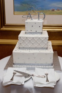 Silver and white buttercream-frosted wedding cake.