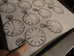 Cutting out the watches on the Shrinky Dink paper!