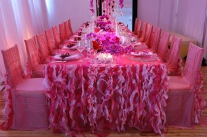 Beautiful pink tablescape, pink table cloth with pink ruffles, looks like pink seaweed
