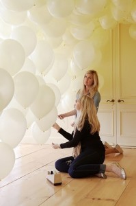 White balloons, and using balloons as a backdrop or background for a party or reception.