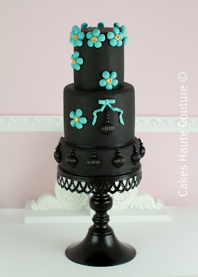 Black wedding cake with tiffany blue trim