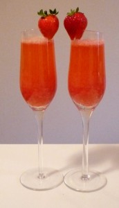 Strawberry bellini champagne and strawberry for a pink party drink