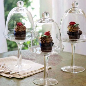 Cupcake in a cloche or glass stand.