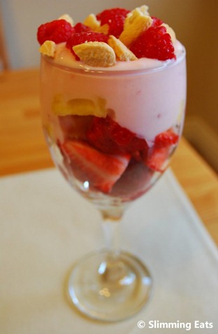 Yogurt and fruit served in a wine glass