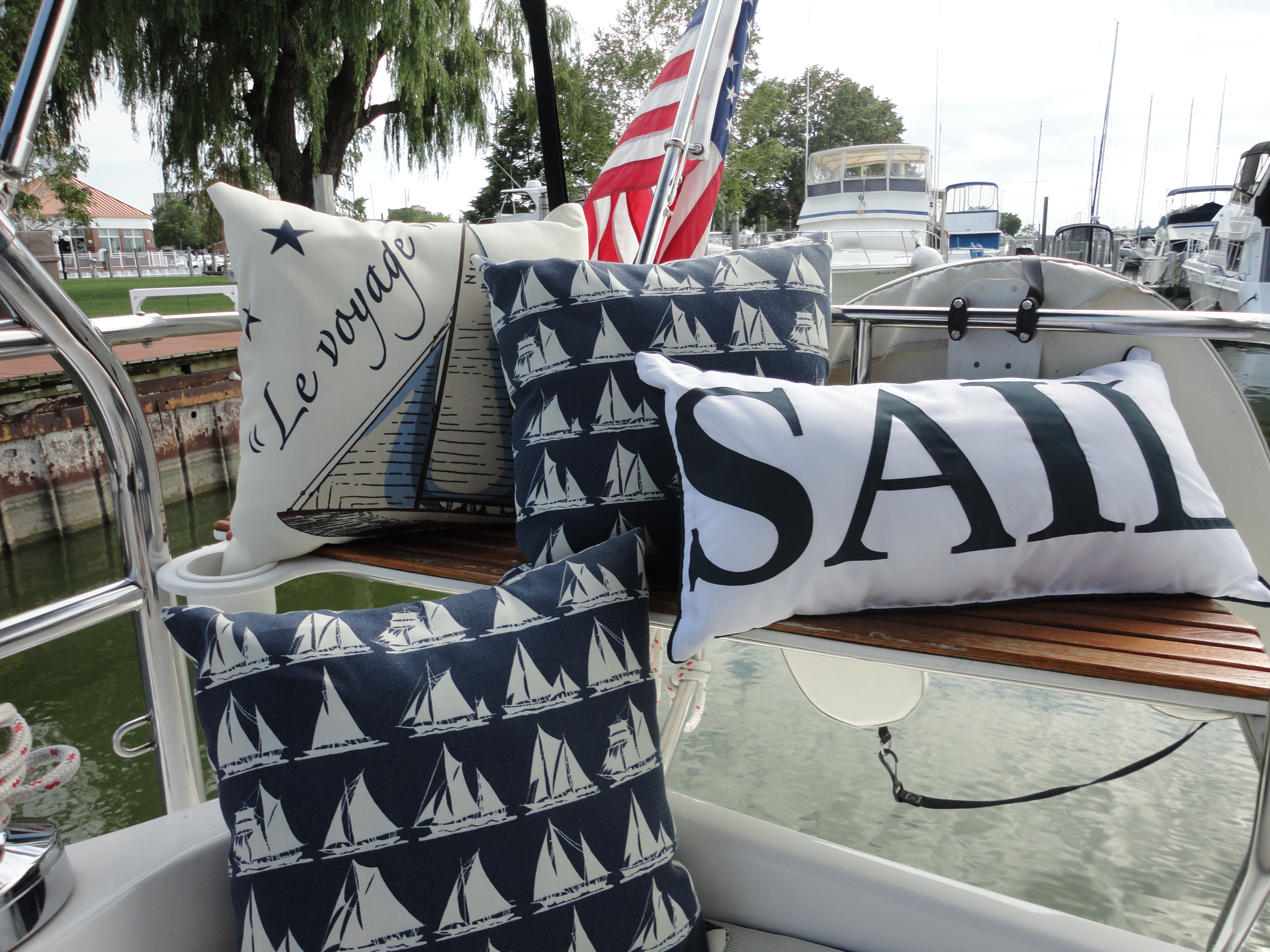 Sailboat pillows with the American Flag in the background